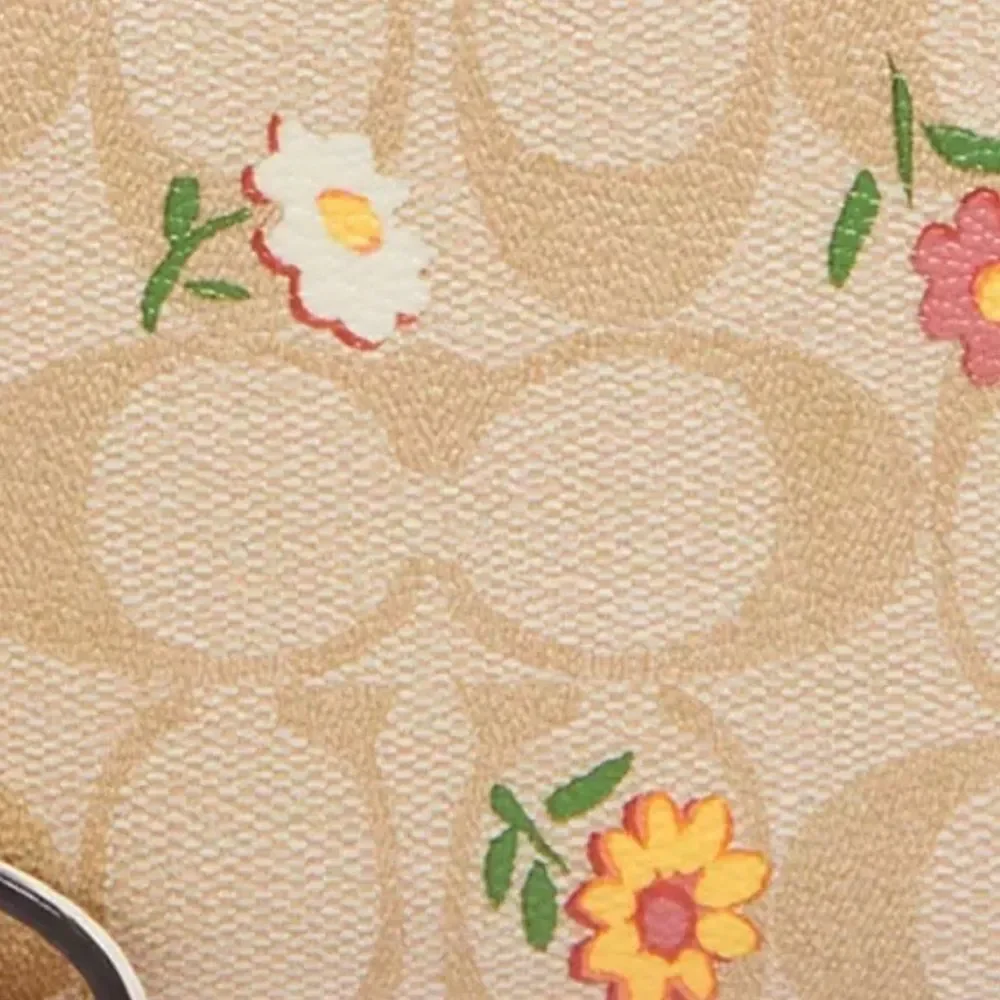Coach Corner Zip Wristlet in signature coated canvas with ditsy floral print NWT